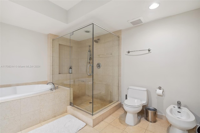 bathroom featuring tile patterned floors, plus walk in shower, a bidet, and toilet