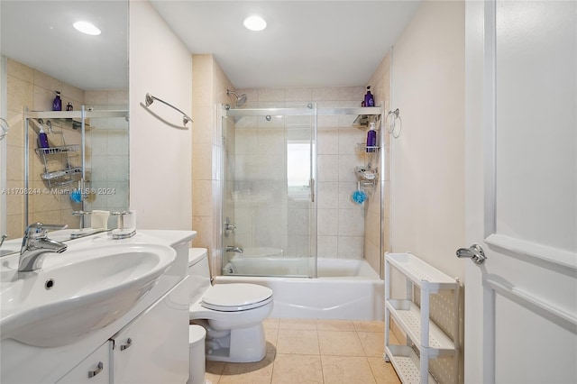 full bathroom featuring tile patterned flooring, vanity, toilet, and enclosed tub / shower combo