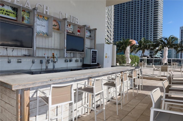 view of patio with an outdoor bar