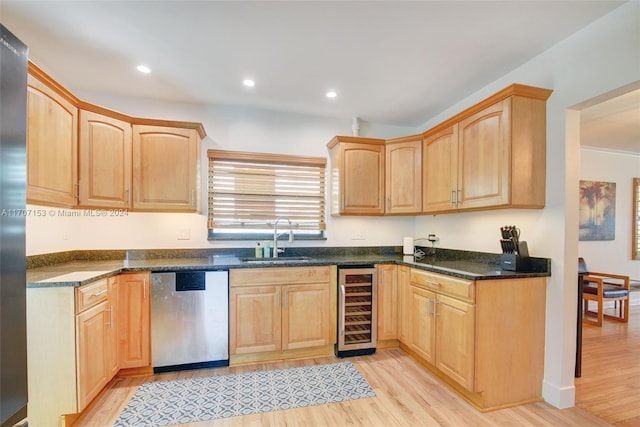 kitchen featuring light hardwood / wood-style floors, stainless steel dishwasher, beverage cooler, and sink