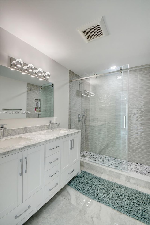 bathroom with vanity and an enclosed shower