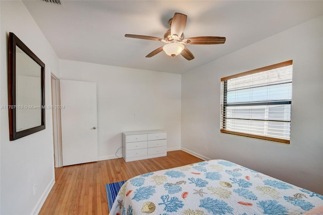 bedroom featuring ceiling fan and light hardwood / wood-style flooring