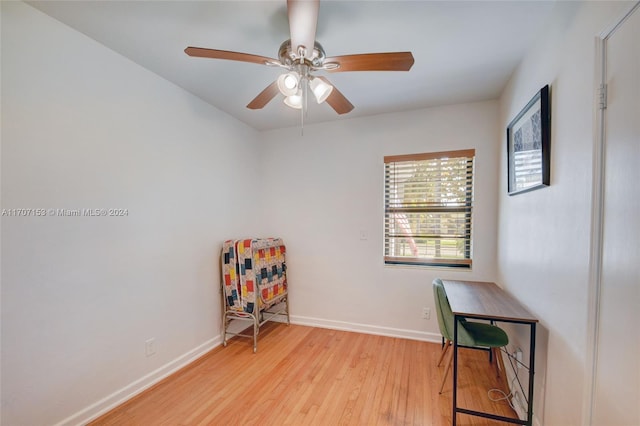 home office with ceiling fan and light hardwood / wood-style floors