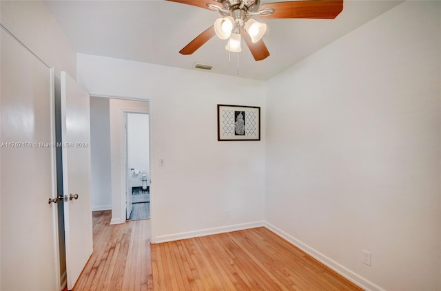 spare room featuring ceiling fan and light hardwood / wood-style floors