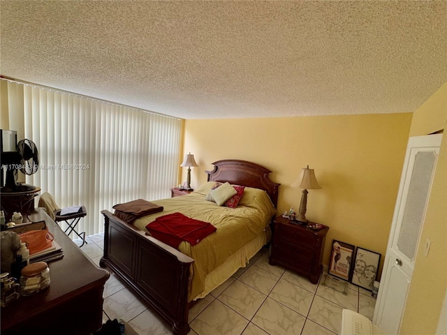 bedroom featuring a textured ceiling