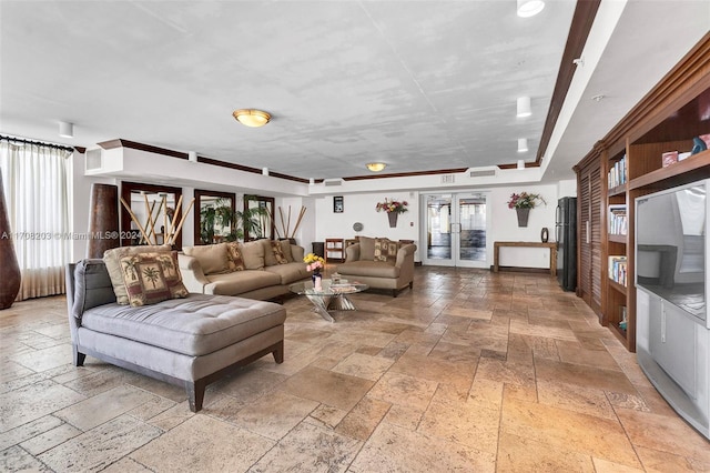 living room with french doors and a healthy amount of sunlight