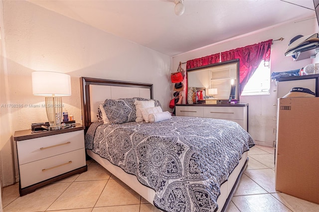 bedroom featuring light tile patterned flooring