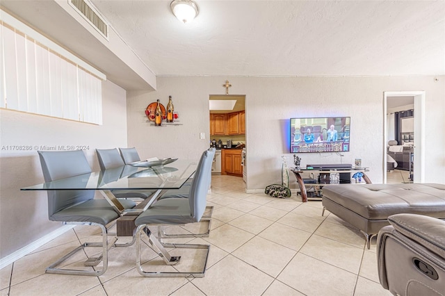 dining area featuring light tile patterned floors