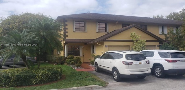 view of front of property with a garage