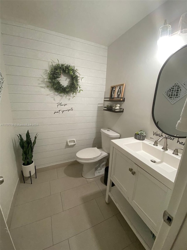 bathroom with tile patterned floors, vanity, and toilet