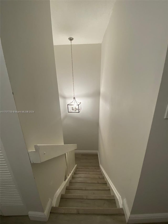 stairs with wood-type flooring