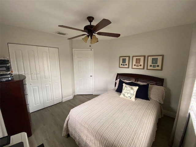 bedroom featuring ceiling fan, a closet, and dark hardwood / wood-style floors