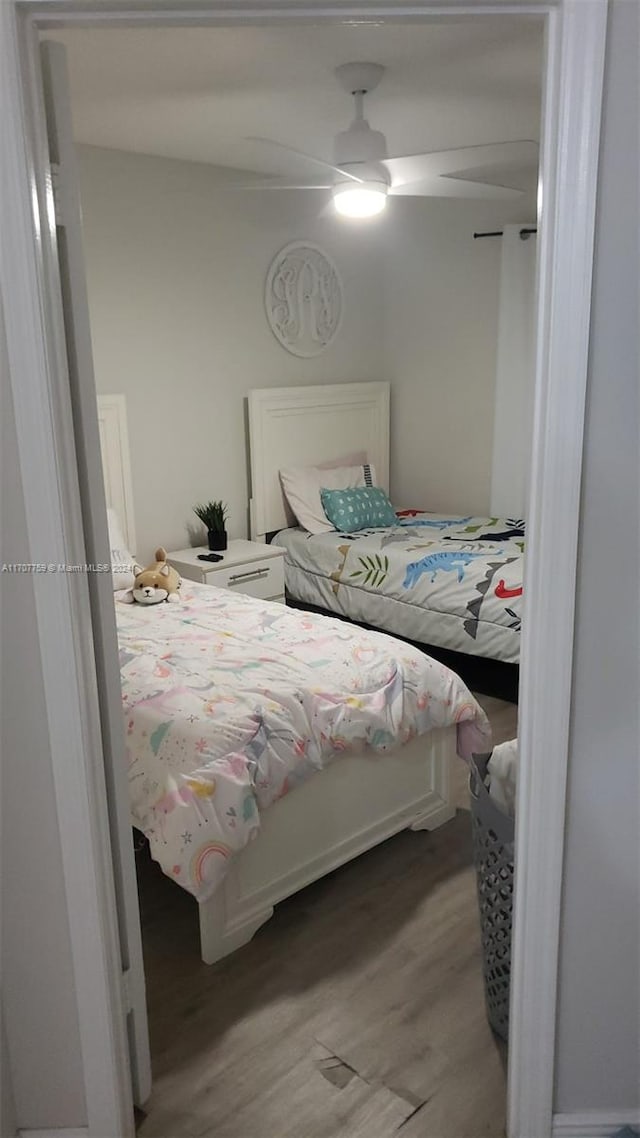 bedroom featuring light hardwood / wood-style flooring and ceiling fan