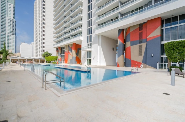 view of pool featuring a patio