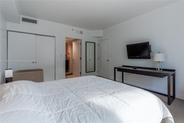 bedroom with carpet floors and a closet