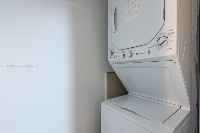 washroom with stacked washer and clothes dryer