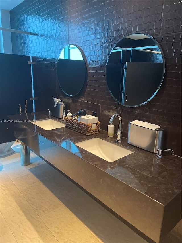 bathroom with tile patterned floors and vanity