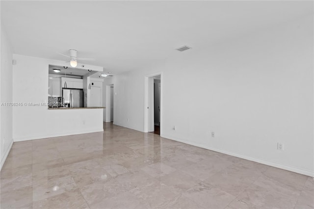 unfurnished living room with ceiling fan