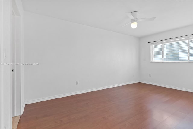 unfurnished room with wood-type flooring and ceiling fan