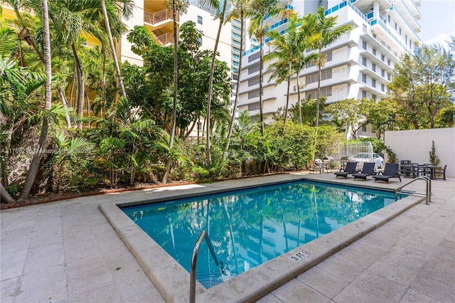 view of pool featuring a patio area