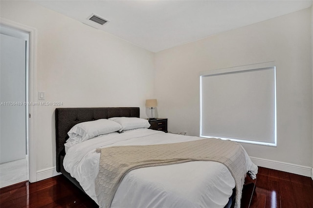 bedroom featuring dark wood-type flooring