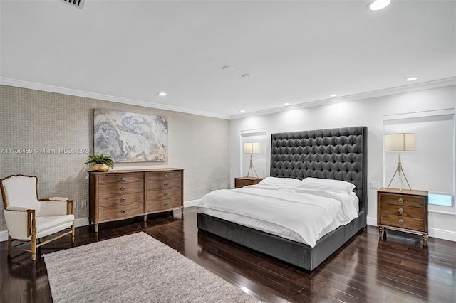 bedroom with crown molding and dark hardwood / wood-style flooring