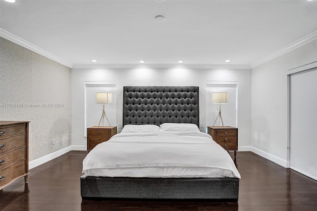 bedroom with crown molding and dark hardwood / wood-style flooring