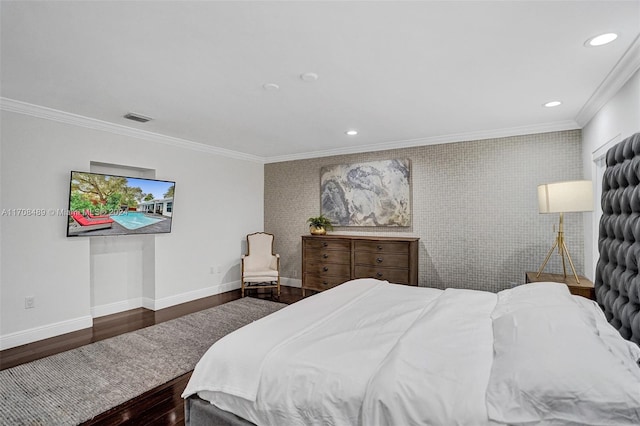 bedroom with dark hardwood / wood-style flooring and ornamental molding