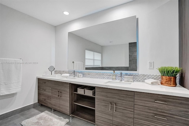 bathroom featuring vanity and backsplash