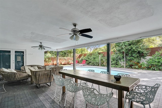 view of patio featuring an outdoor living space, french doors, and ceiling fan