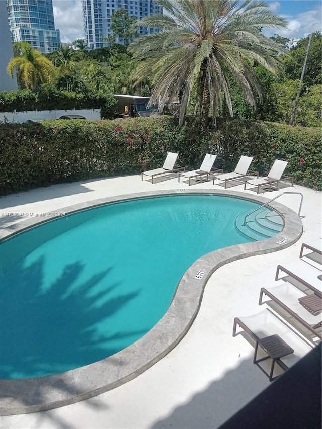 view of pool featuring a patio area