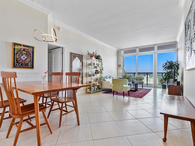 dining area with expansive windows, an inviting chandelier, light tile patterned floors, and crown molding