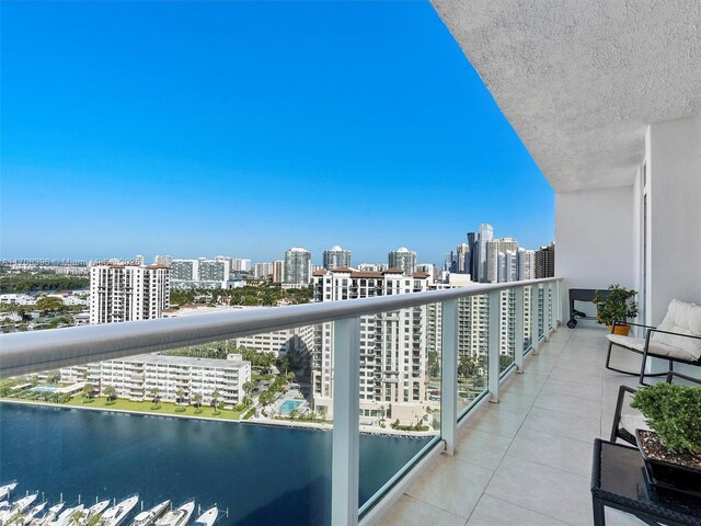 balcony featuring a water view