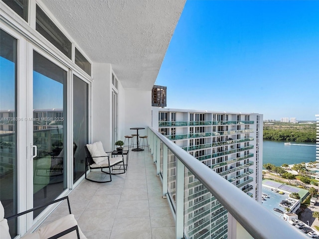 balcony featuring a water view