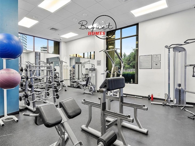 workout area with a paneled ceiling