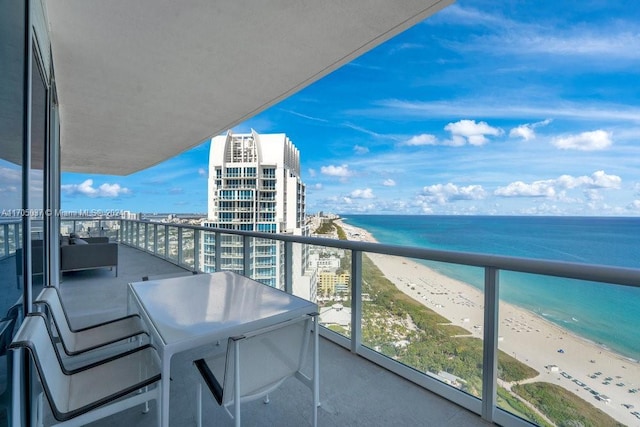 balcony with a view of the beach and a water view