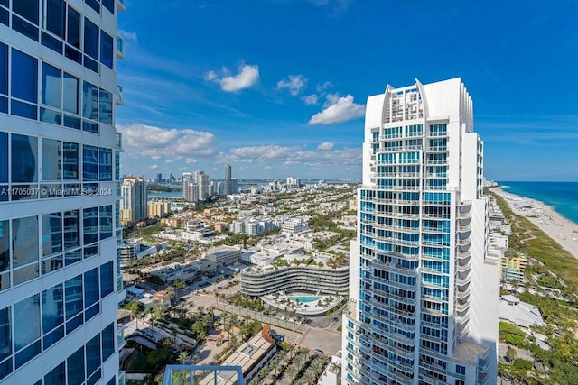 city view featuring a water view and a view of the beach