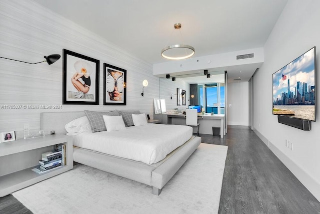 bedroom featuring dark hardwood / wood-style flooring