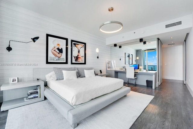 bedroom featuring dark hardwood / wood-style floors