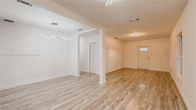 spare room featuring light wood-type flooring