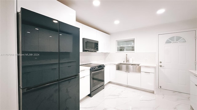 kitchen featuring white cabinetry, sink, and black appliances