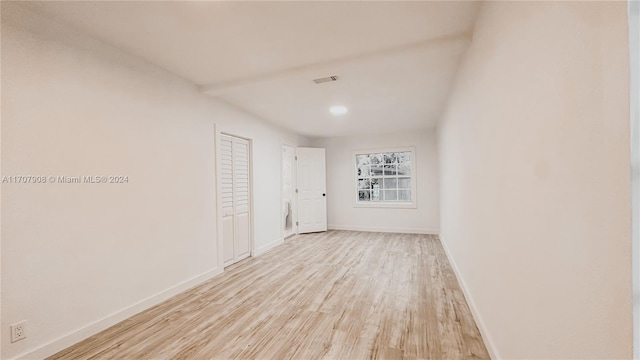 spare room with light hardwood / wood-style floors