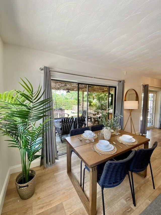 dining area with light hardwood / wood-style flooring