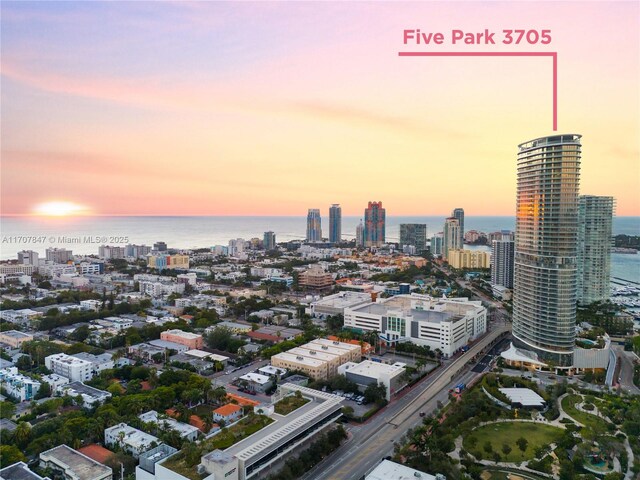 aerial view at dusk with a water view