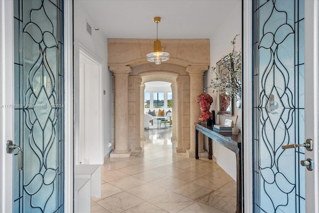 entryway featuring decorative columns