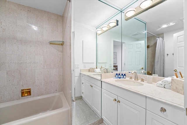 bathroom with vanity, tile patterned floors, and shower / bath combo with shower curtain