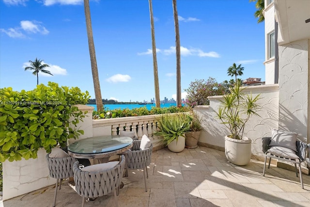 view of patio featuring a water view