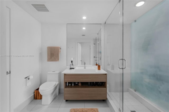 bathroom with walk in shower, tile patterned flooring, vanity, and toilet