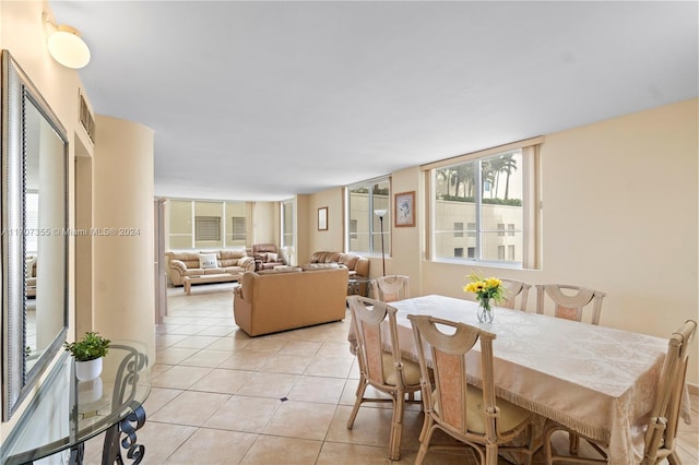 dining area featuring light tile patterned floors