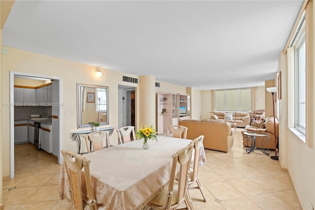 dining space with a healthy amount of sunlight and light tile patterned flooring